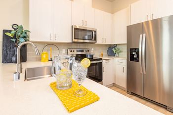 a modern kitchen with stainless steel appliances at Solasta, Sacramento, CA, 95831